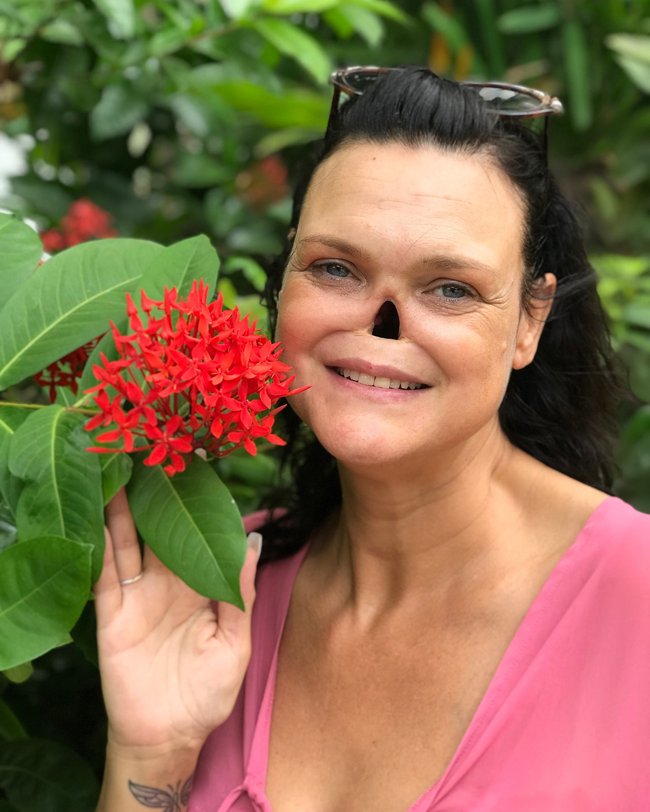 Tina standing in a garden in Jamaica